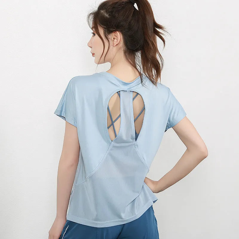Women's short sleeve athletic t-shirt in sky blue, suitable for yoga and fitness.
