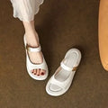 Apricot leather peep toe platform sandals with rubber soles shown from side view