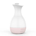 White ultrasonic aromatherapy diffuser with colourful LED light misting essential oils