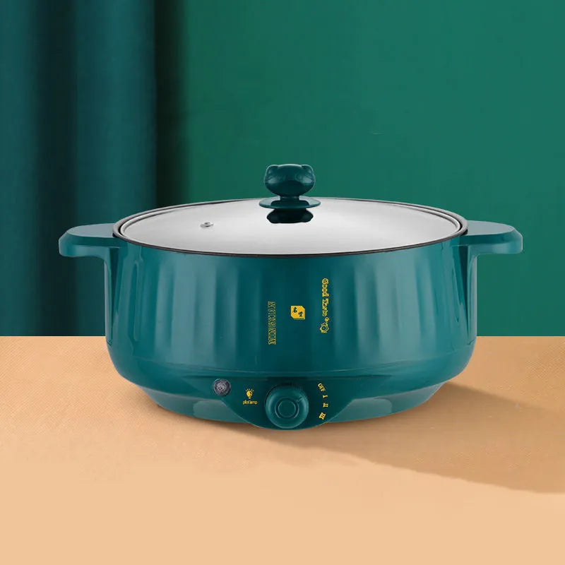 Stainless steel electric hot pot with non-stick coating and integrated heating base.