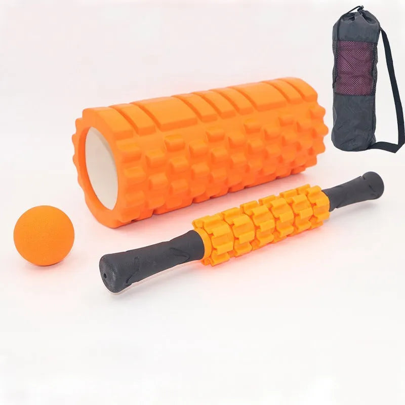Black foam fitness roller with six-piece gear design, 33cm length, for massage and recovery.