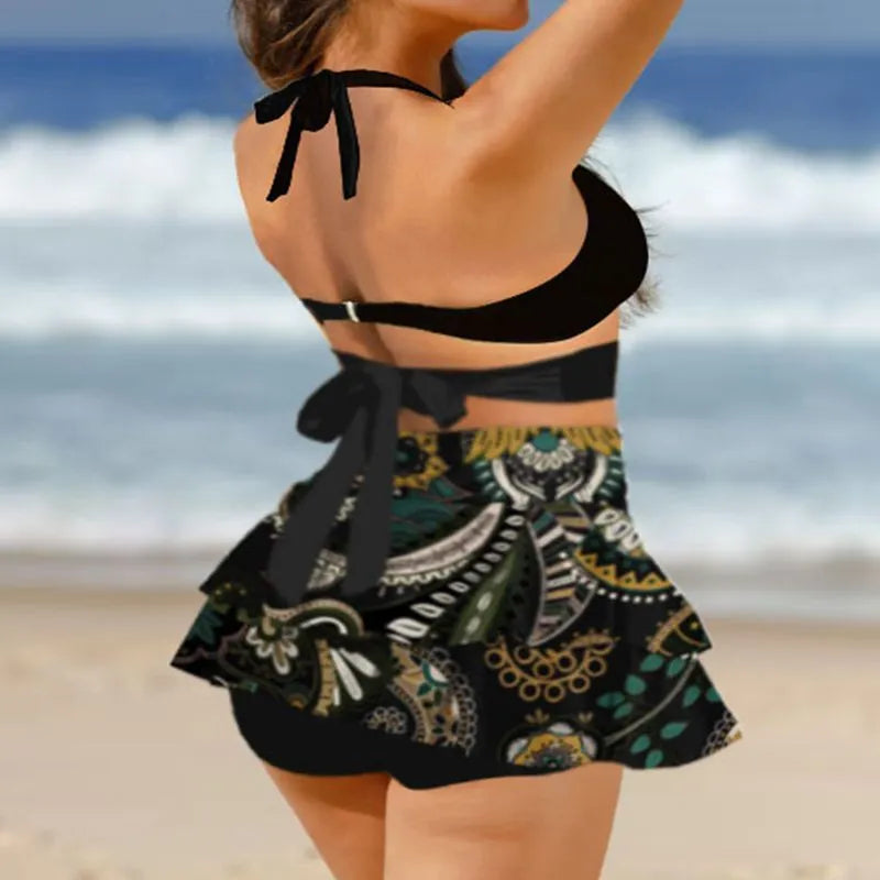 Women's purple lace-up high waist bikini set with matching swim skirt laid flat.