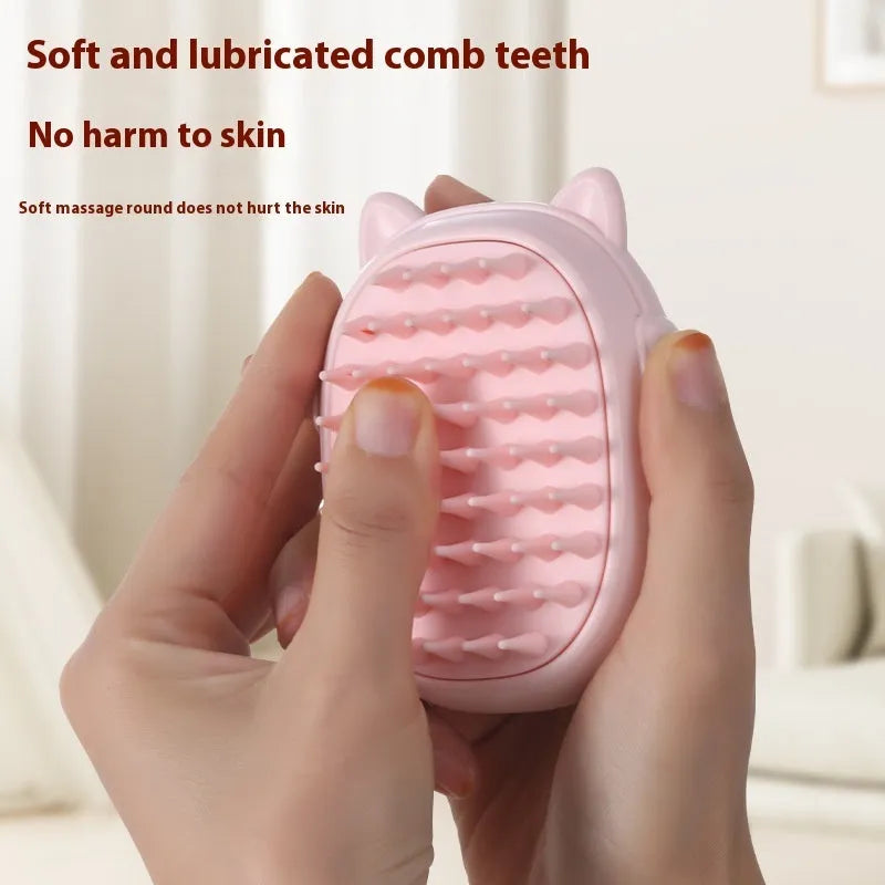 Pink and yellow pet grooming comb with integrated laser pointer toy for cats and dogs