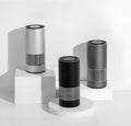 Compact metallic car air purifier on a dashboard with Black, Silver, and Grey colour options.
