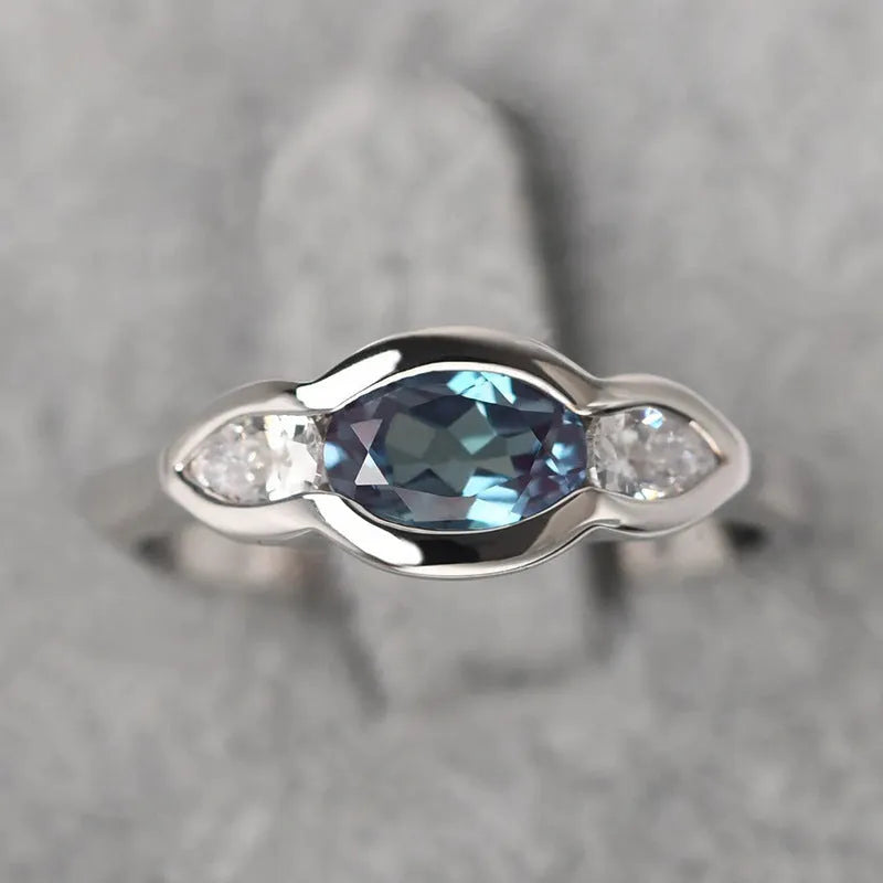 Women's geometric ellipse ring in white gold finish with inlaid zircon stones on copper