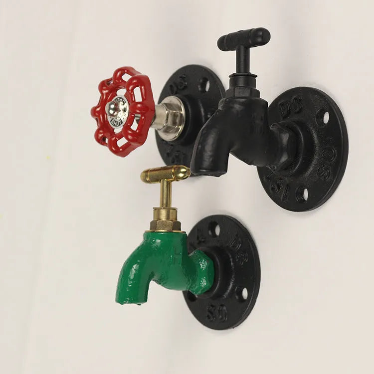 Metal water pipe style towel hook mounted on a wall in black, green, or red.