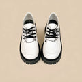 Women's solid colour preppy loafers with a round toe and a metal cross-strap in Duke asterism.