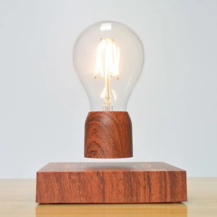 Magnetic levitation floating bulb lamp with glass bulb and imitation wood base