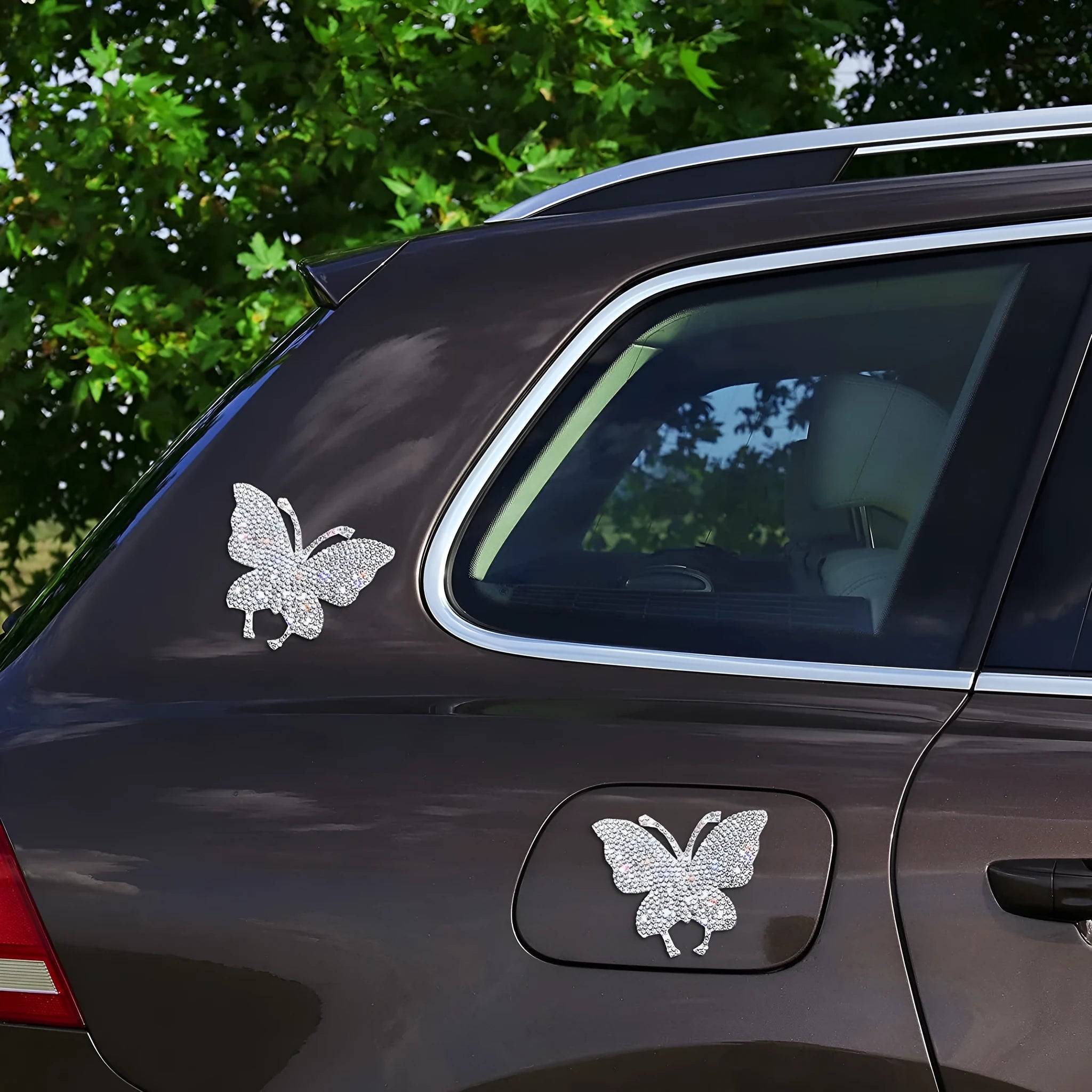 Glass car sticker decal showing bear paw or butterfly design choice on clear background.