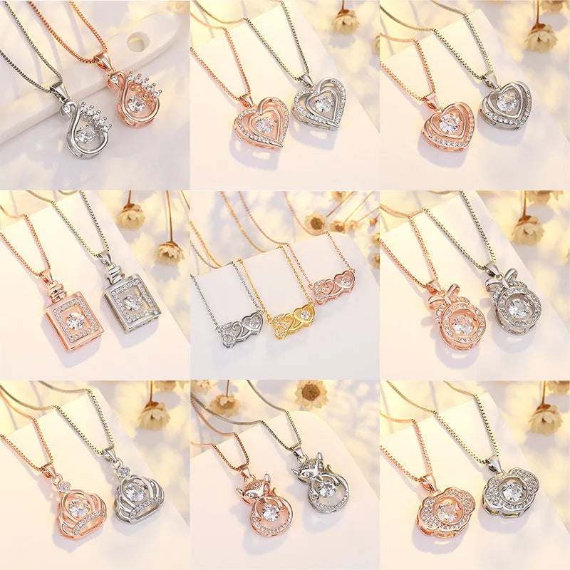 Sterling silver heart-shaped pendant necklace with crown and bow details on an adjustable chain.