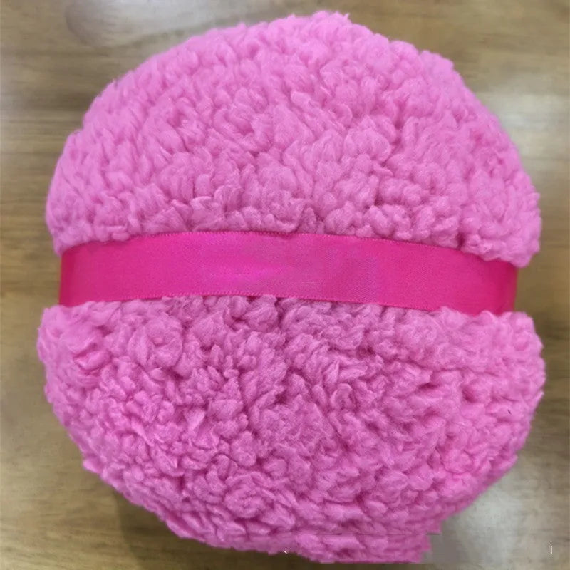 Oversized rectangular plush powder puff in pink, white, or skin colour on a plain background.
