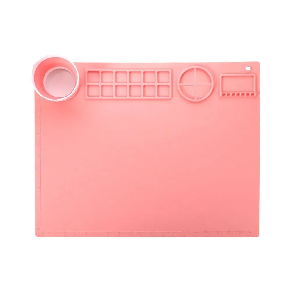 Silicone double bowl painting mat for watercolour art in various colours on a table