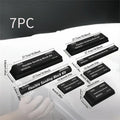 Set of seven black frosted EVA foam blocks inside a metal storage case.