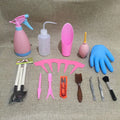 Succulent gardening tool set showing mini shovel, watering can, tweezers, brush, and rake on a table