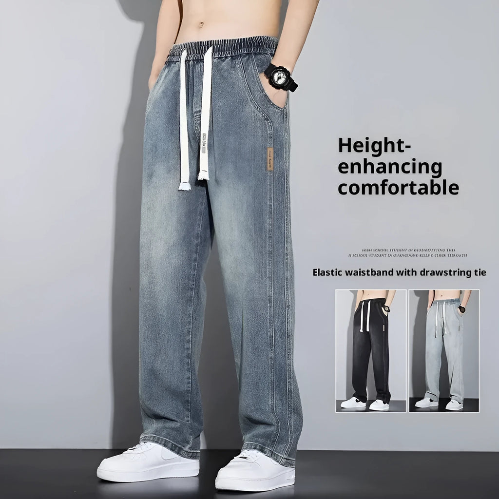 Men's loose fit straight leg cotton denim jeans with elastic waist and rope closure, available in four colours