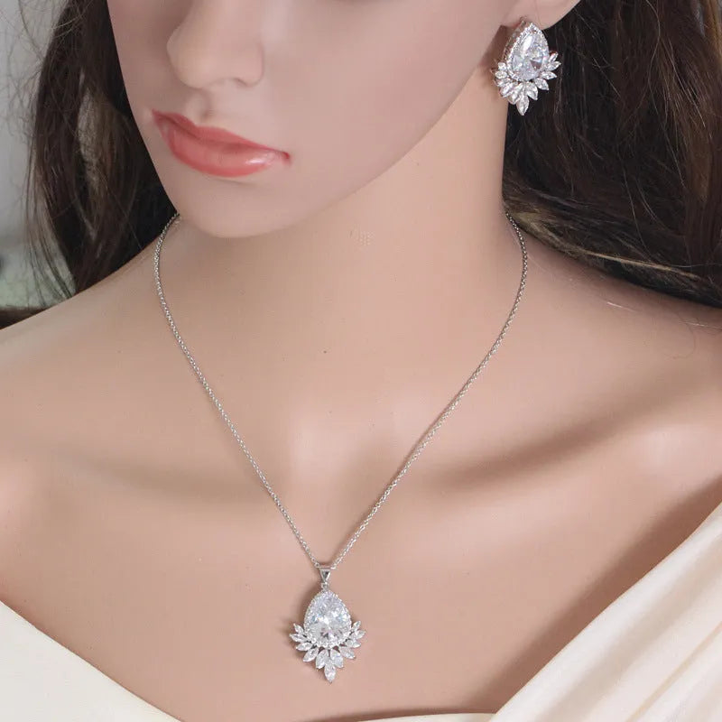 Bridal jewellery set with necklace and earrings in blue, red, or white crystals for formal banquets.