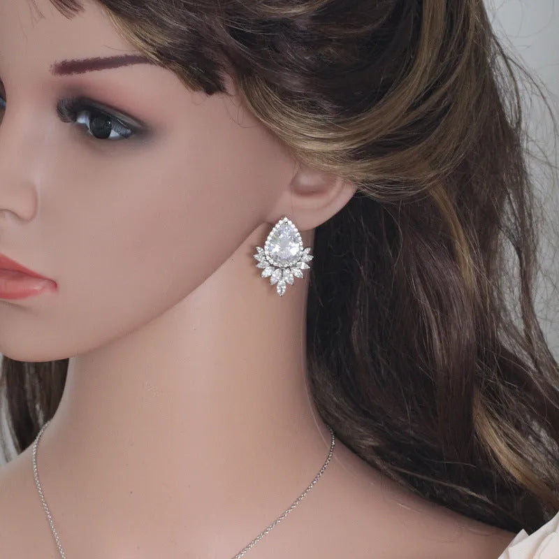 Bridal jewellery set with necklace and earrings in blue, red, or white crystals for formal banquets.