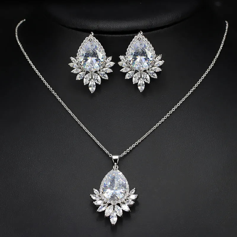 Bridal jewellery set with necklace and earrings in blue, red, or white crystals for formal banquets.