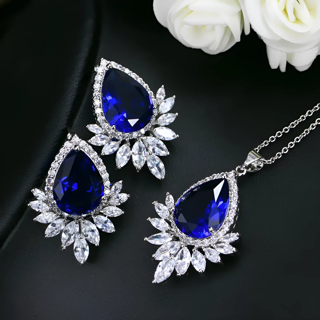 Bridal jewellery set with necklace and earrings in blue, red, or white crystals for formal banquets.