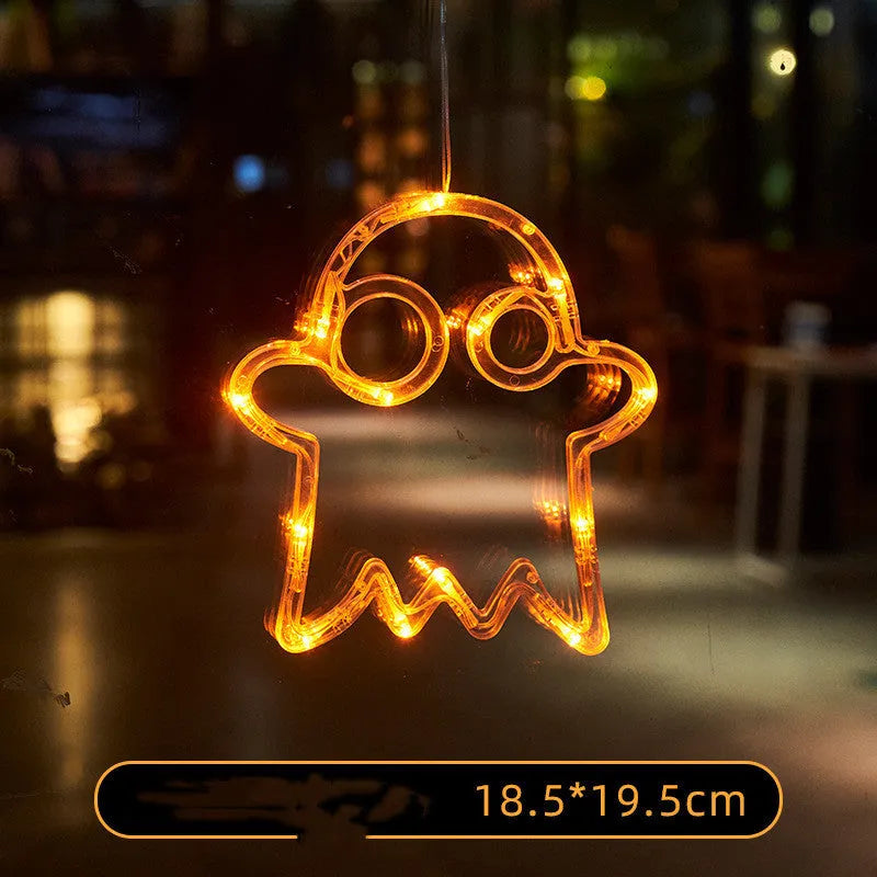 Halloween battery-powered LED window lights with suction cups showing spider, pumpkin and ghost designs