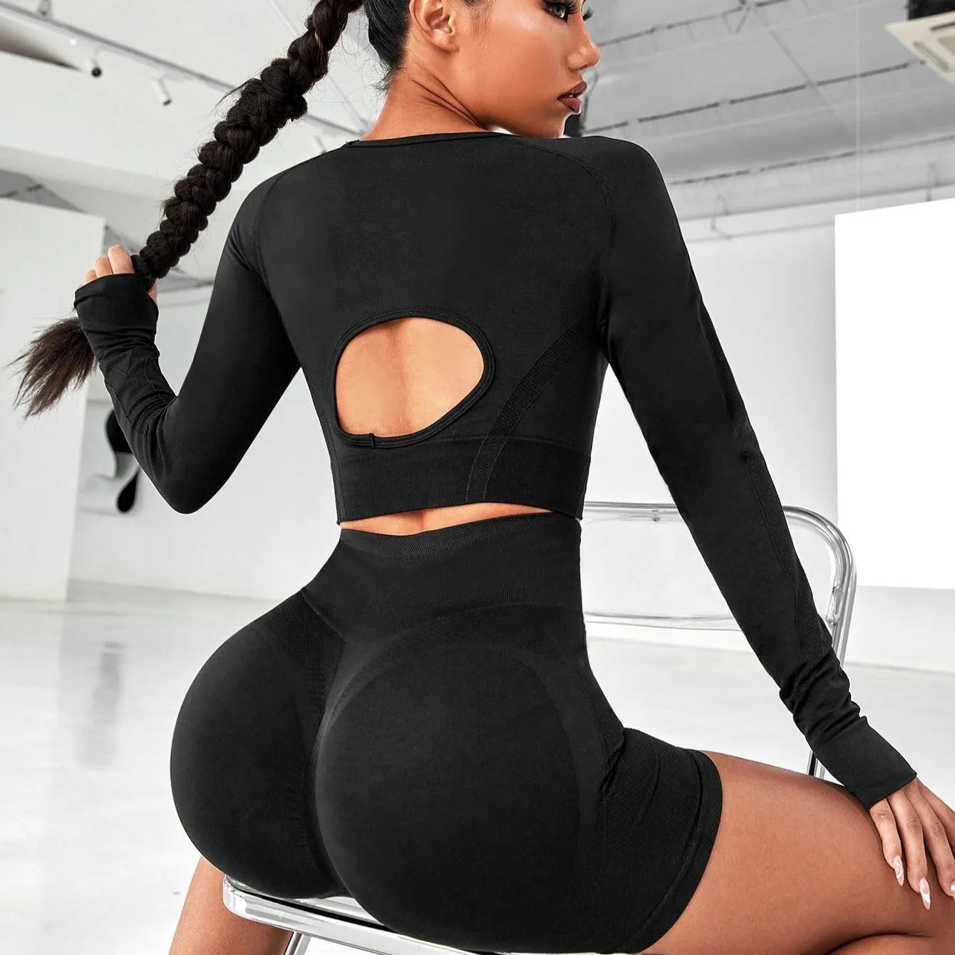 Women's yoga clothes suit in black showing high waist hip lift design with long sleeve top and pants