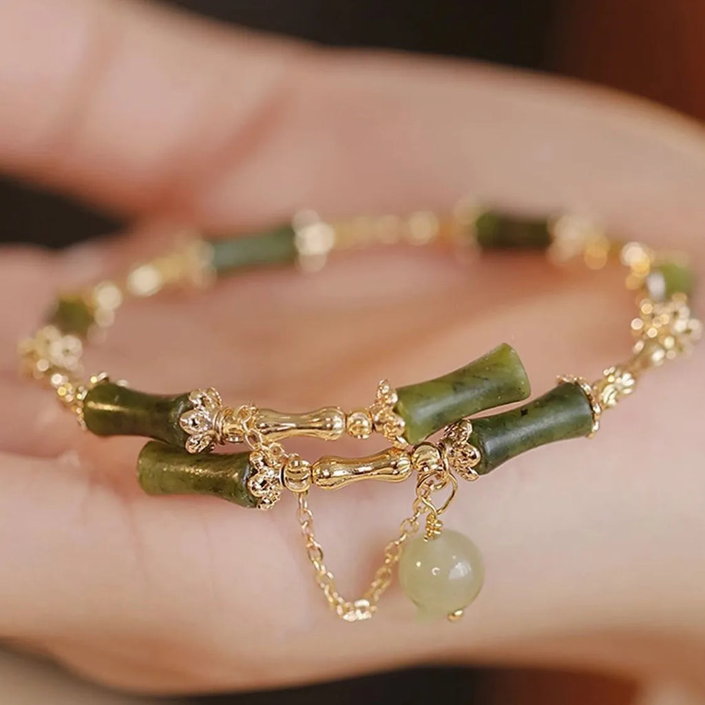 Personalised plum wine coloured glaze bracelet with a central bamboo joint bead for women.