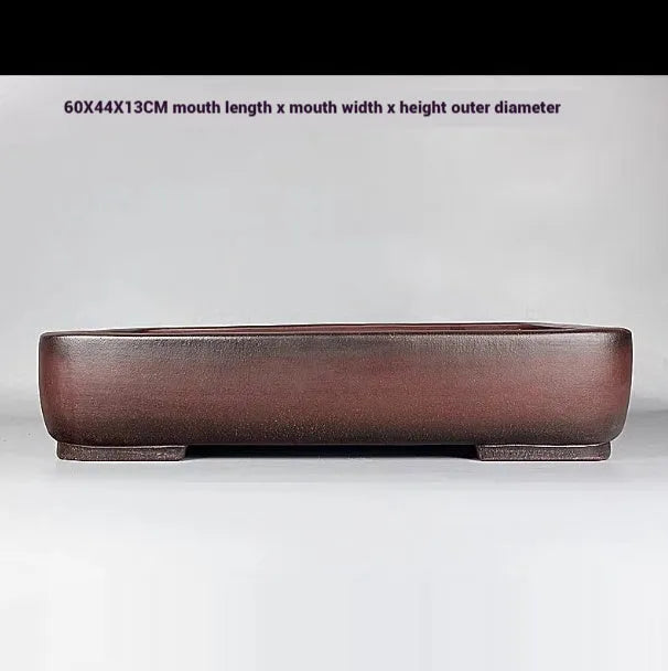 Handmade antique rectangular purple clay flower pot showing traditional finish