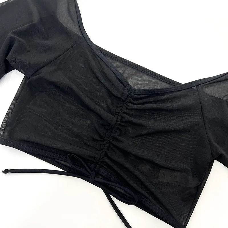 Women's black mesh four-piece bikini set with long sleeve crop top and high-waisted briefs