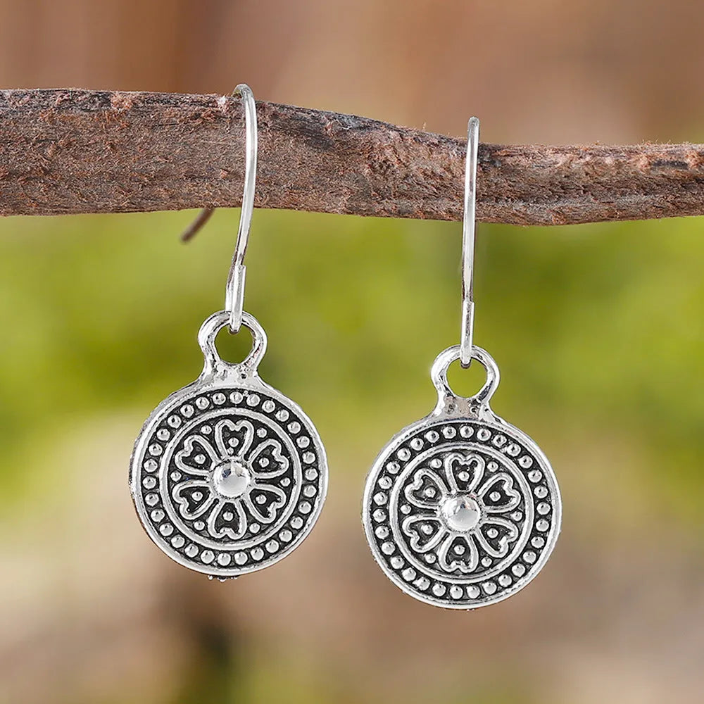 Geometric round earrings with distressed ethnic print in zinc alloy with electroplated finish