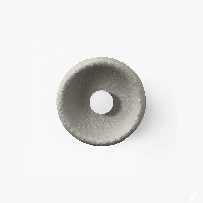 Japanese minimalist wall lamp in resin with warm light, showing three size options
