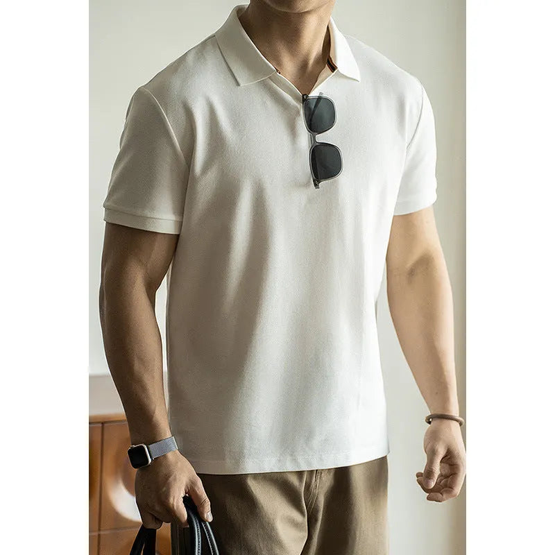 Man's American-style blue cotton blend short-sleeved polo shirt on a hanger.