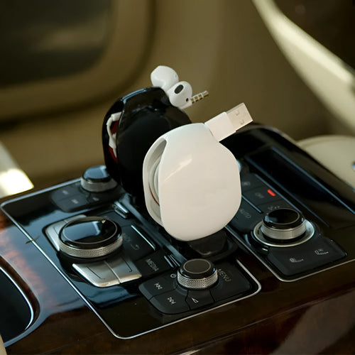 Automatic earphone cable winder in multiple colours with push-type retraction mechanism.