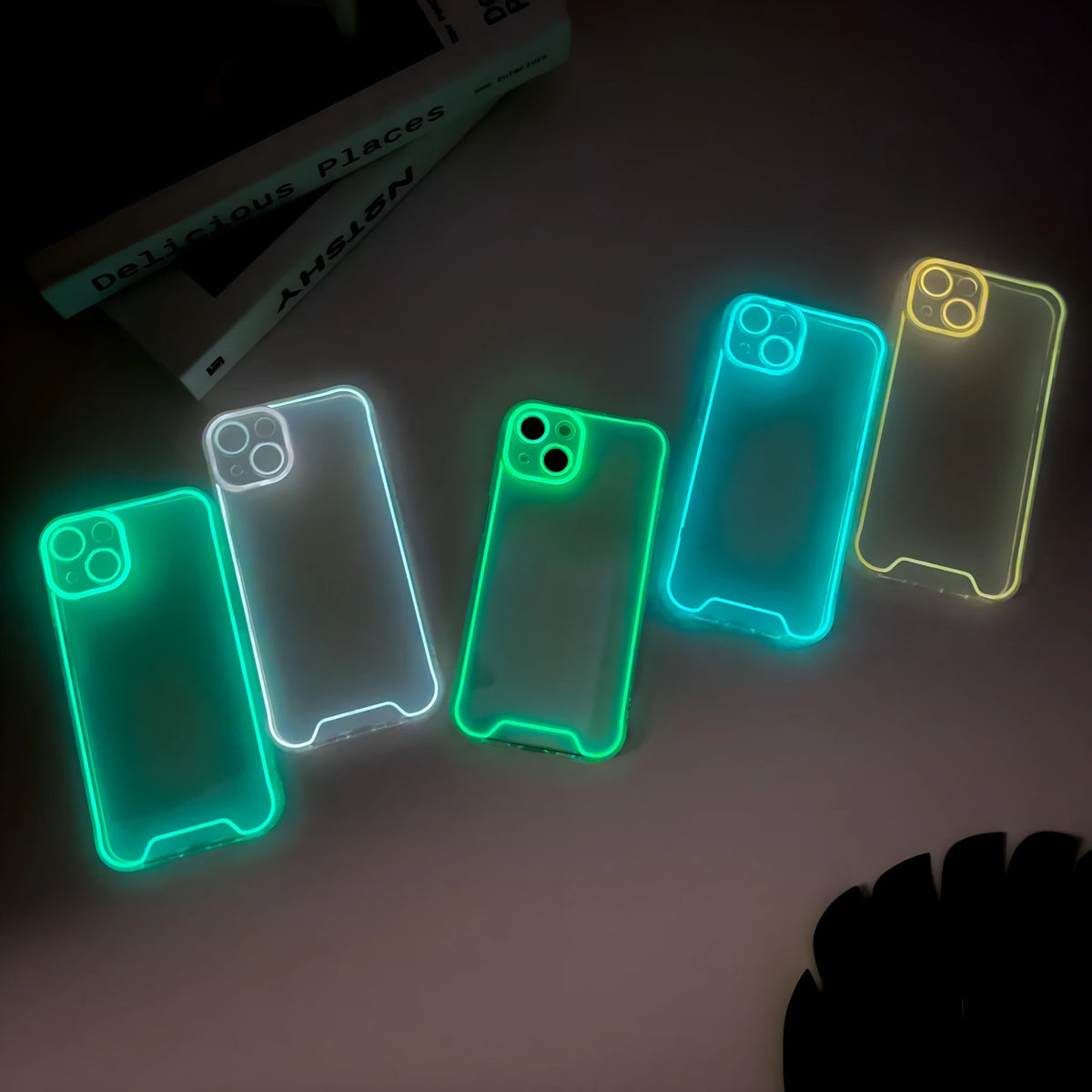 Glow in the dark Christmas phone case for iPhone in green, orange, blue, yellow, pink colours.