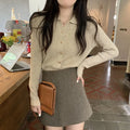 Women's beige loose-fit viscose knitted cardigan top with long sleeves shown worn open.