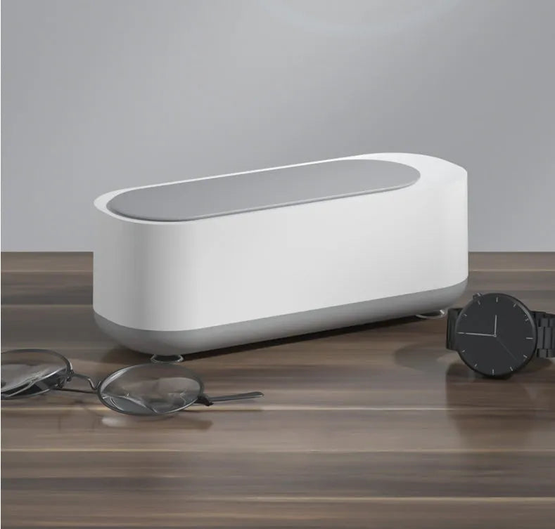 Off-white ultrasonic cleaning machine with 45000Hz vibration and SUS 304 stainless steel tank for jewellery, glasses, and watches.