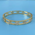 Women's hollow bracelet with four-leaf clover design and zircon stones in gold or silver