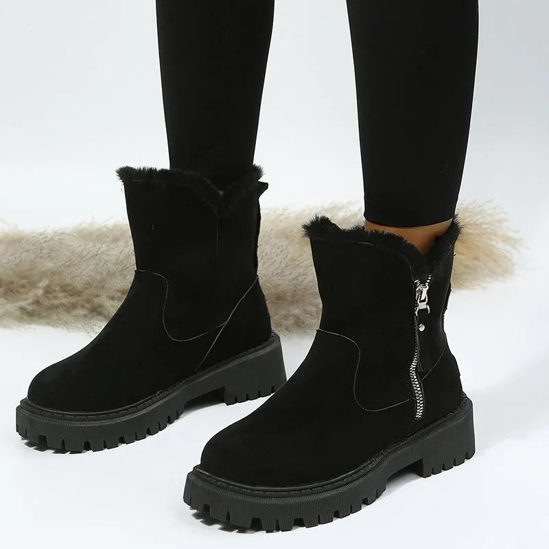 Women's black high-top plush snow boots with a side zipper and thick rubber sole