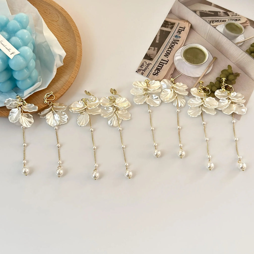 Women's acrylic shell pearl tassel earrings with multiple clip options showing 8.8cm length