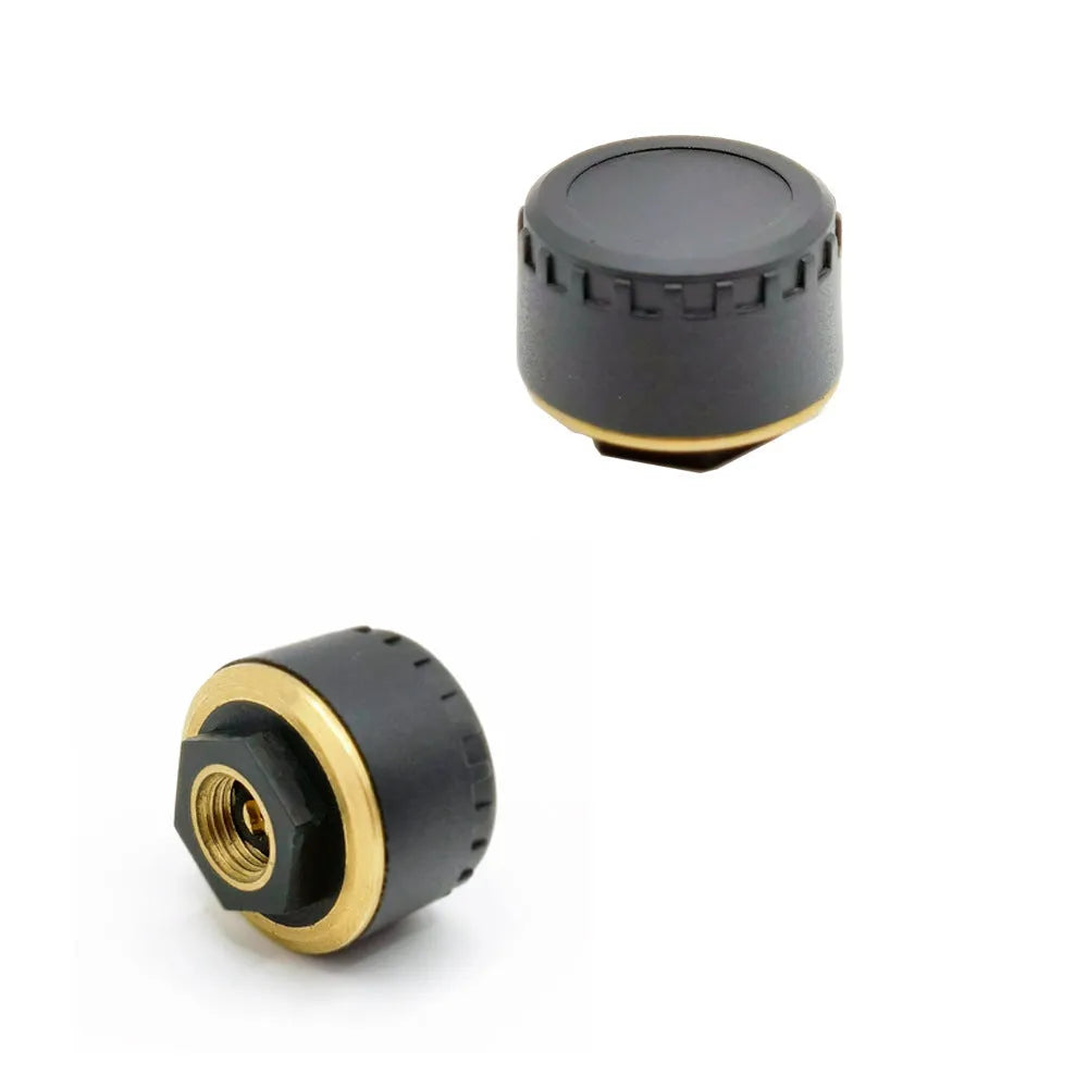Four black Bluetooth tyre pressure monitors for mobile phone app display.