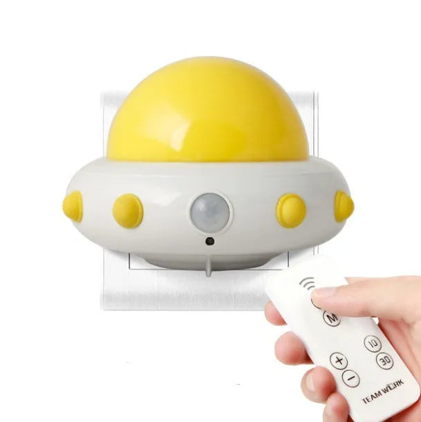 Remote control UFO shaped bedside night light in blue, pink, or white colour options.