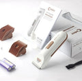 White electric pet hair clipper with ceramic blade on a table