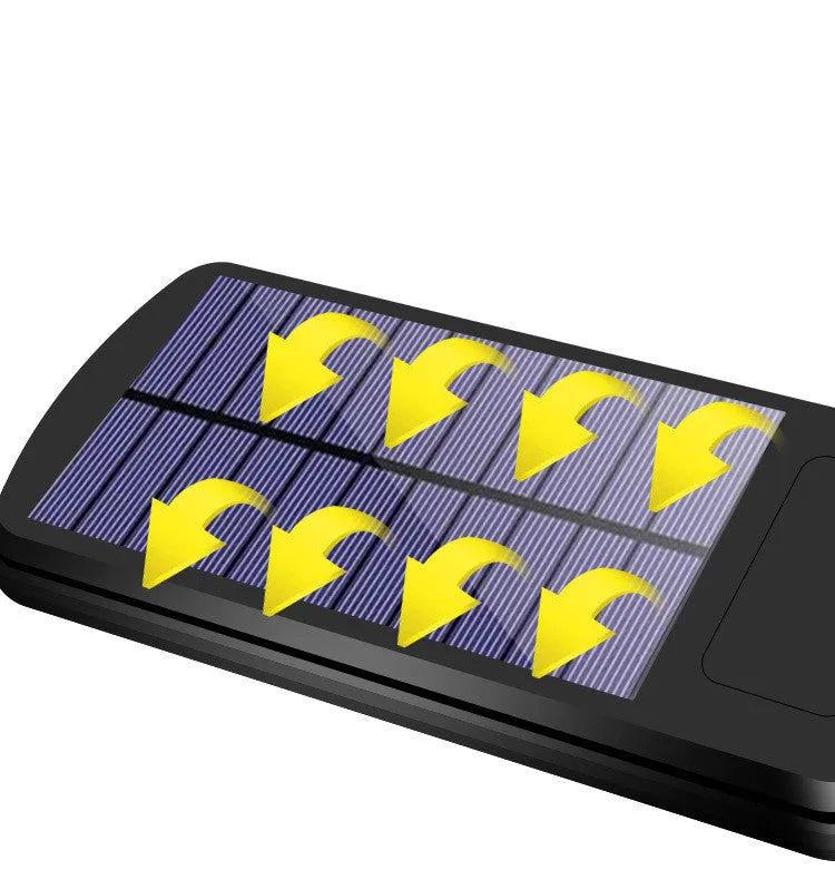 Black solar motion sensor light for outdoor garden and security lighting with PIR detection