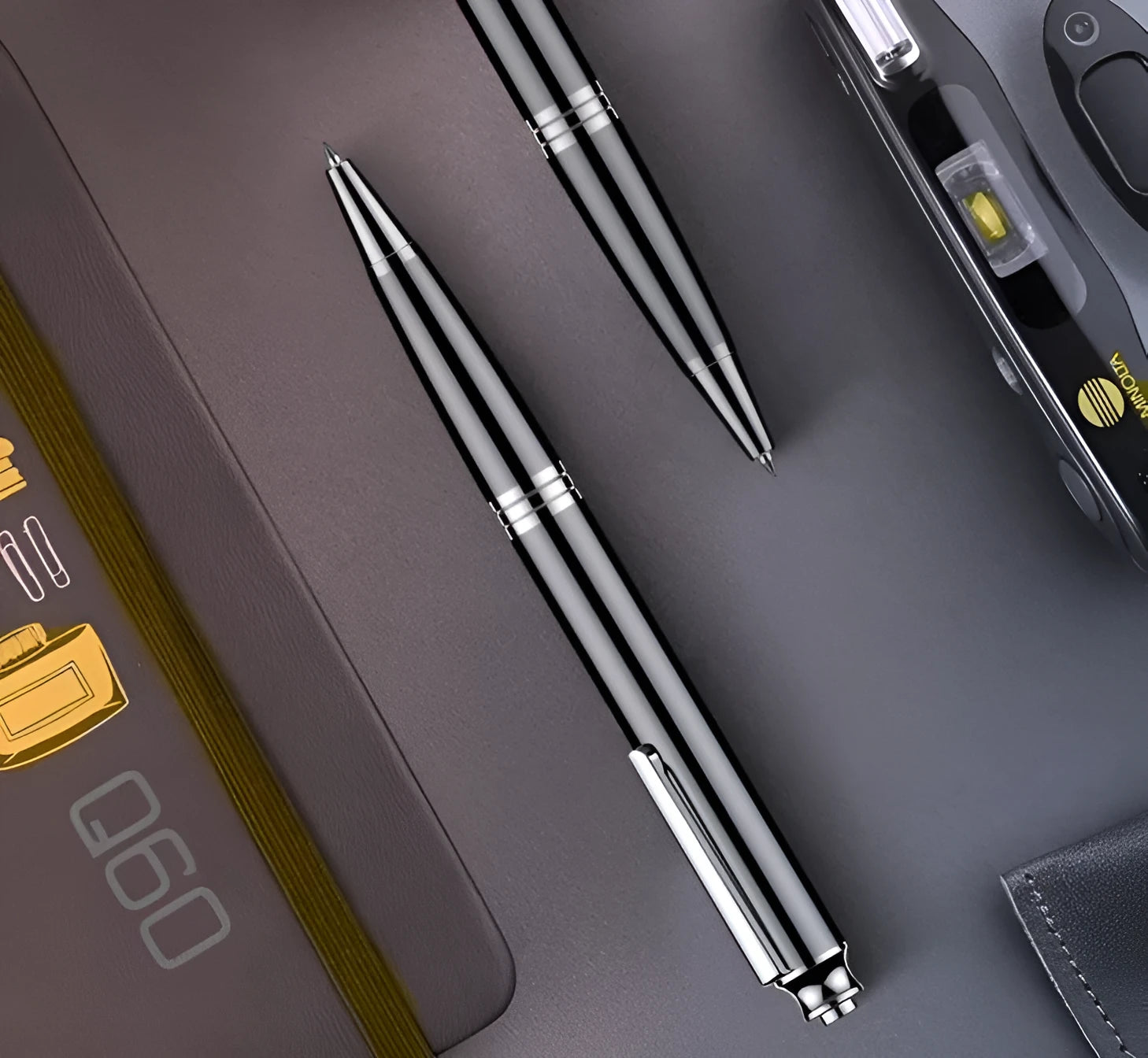 Black pen-style USB recorder MP3 player showing length and thickness.