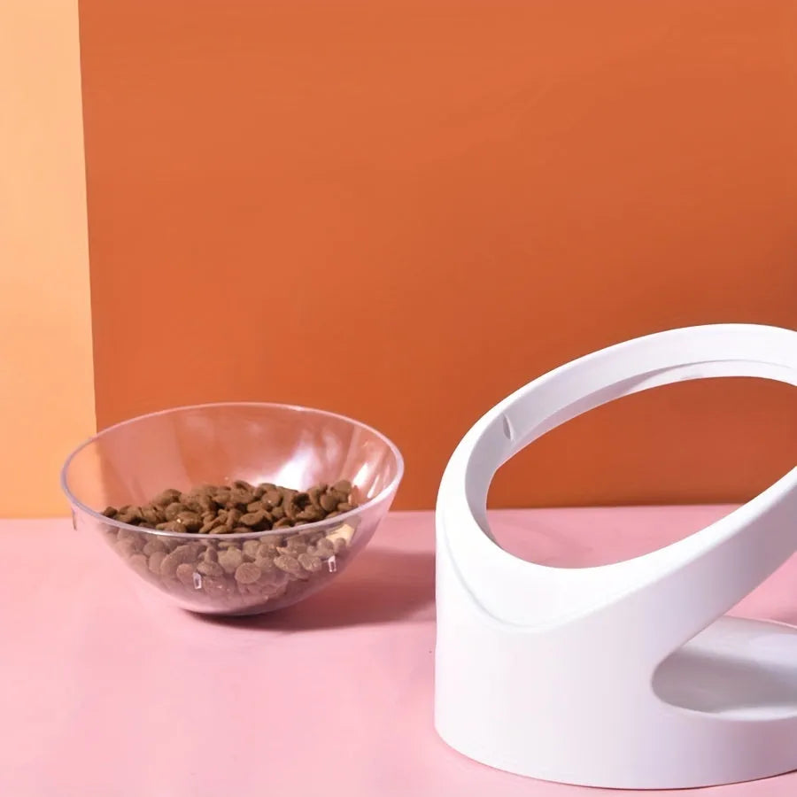White clear elevated plastic cat food bowl with anti-vomit tilt design.