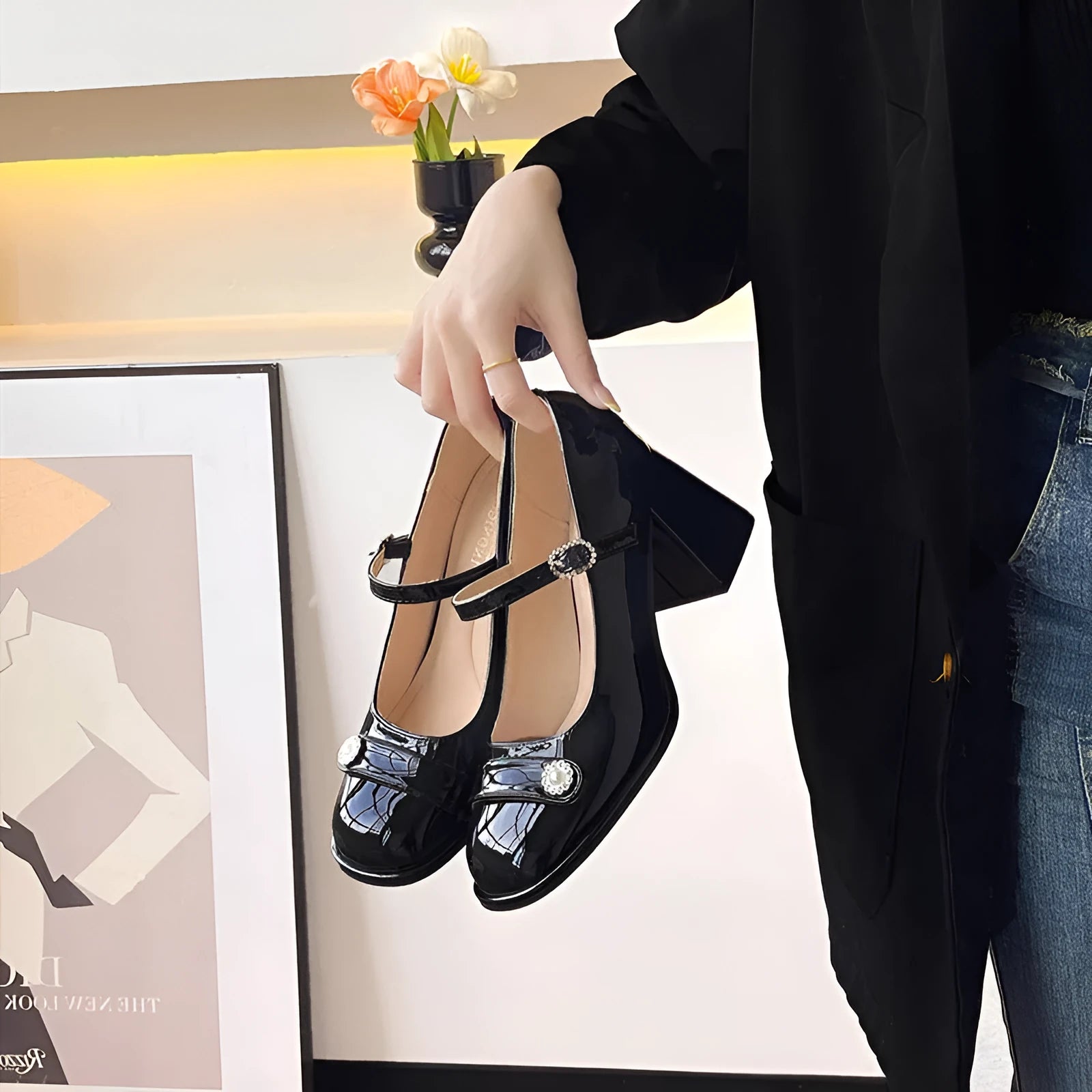 Women's black patent leather chunky heel shoes with round toe and buckle fastening