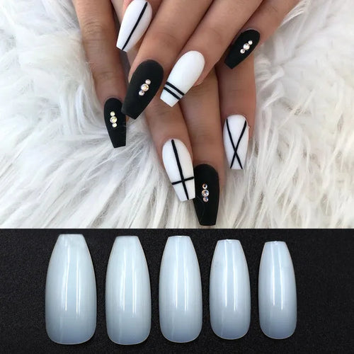 500 clear and natural ABS acrylic false nails in 10 sizes spread on a table