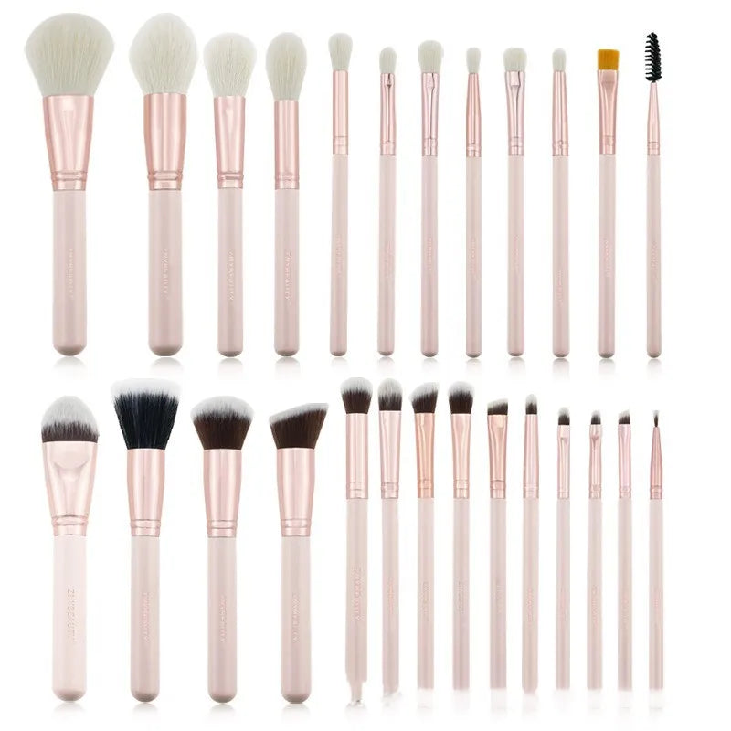 26-piece pink makeup brush set with wooden handles and a grey PU storage case, arranged open.