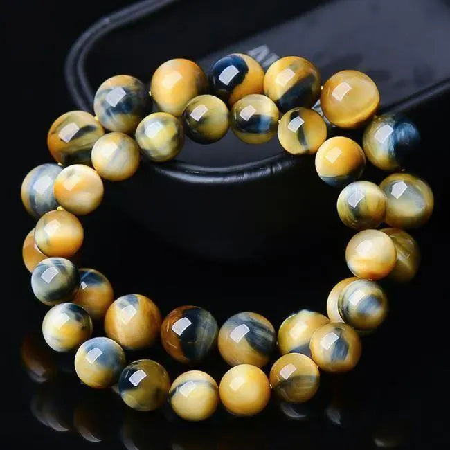 Natural fantasy tiger eye agate bracelet with round geometric beads on a wrist