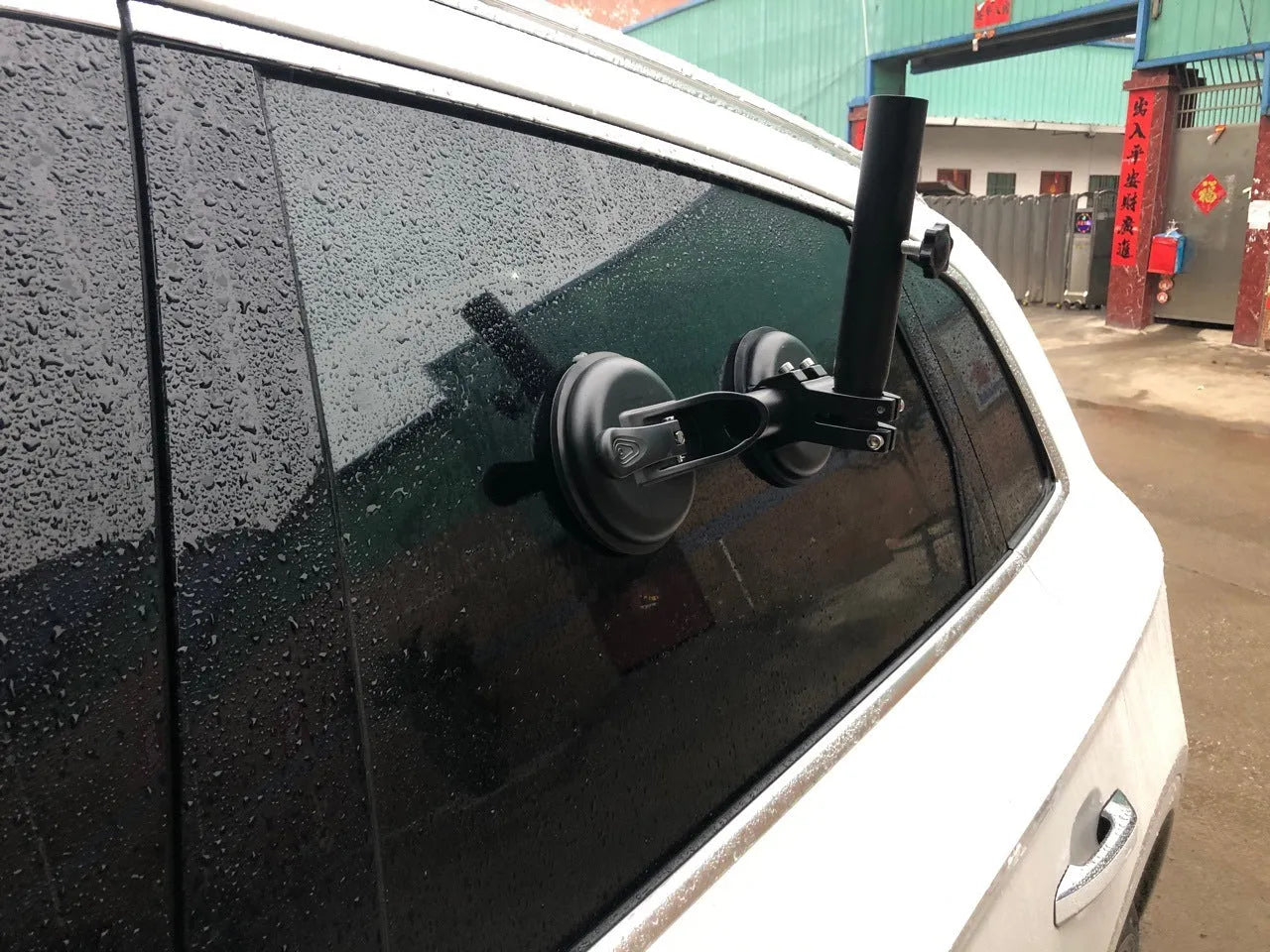 Black off-road car glass sucker mount with round rubber suction cup on ABS plastic base