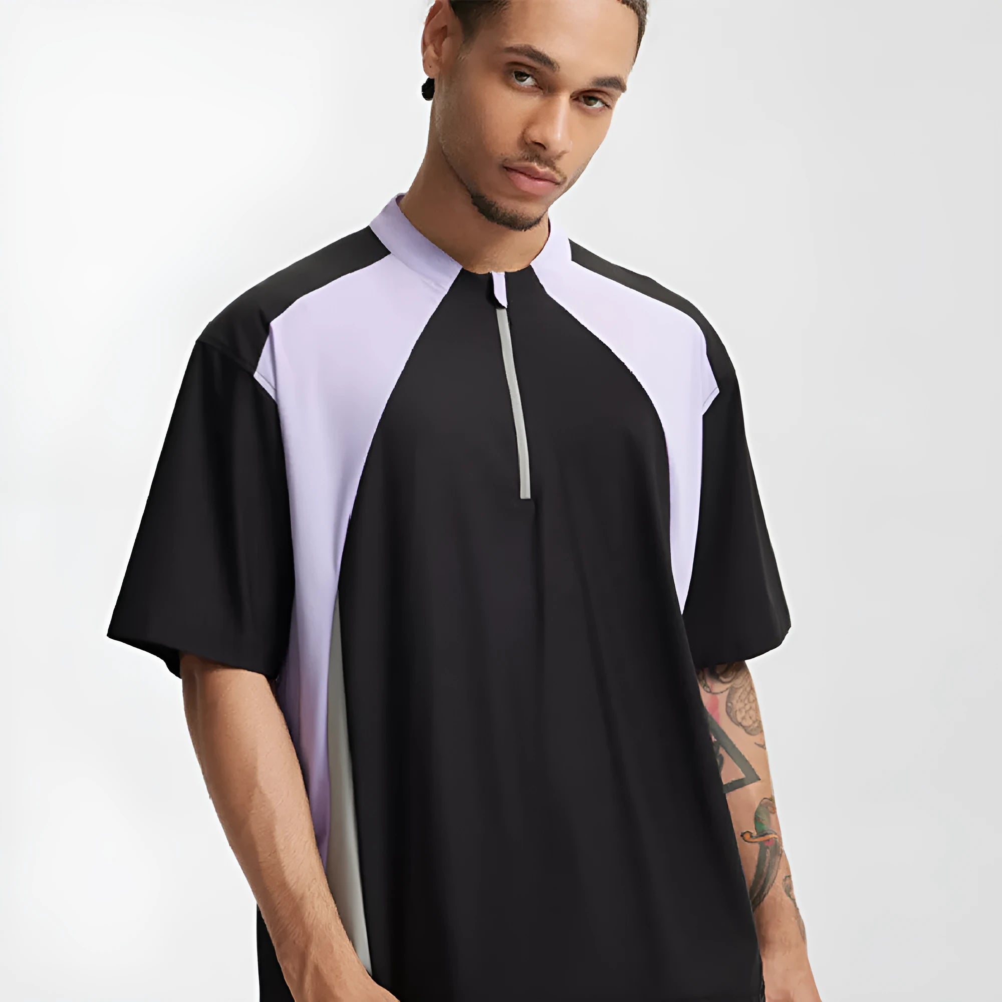 Men's lightweight solid colour polyester top with stitching detail, shown in black and beige with long and short sleeve options.